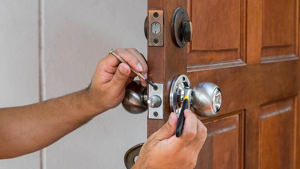 Professional Emergency Locksmith Needham MA providing fast car lockout assistance with specialized tools.