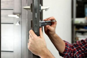 Emergency locksmith unlocking a residential front door in Chestnut Hill, MA